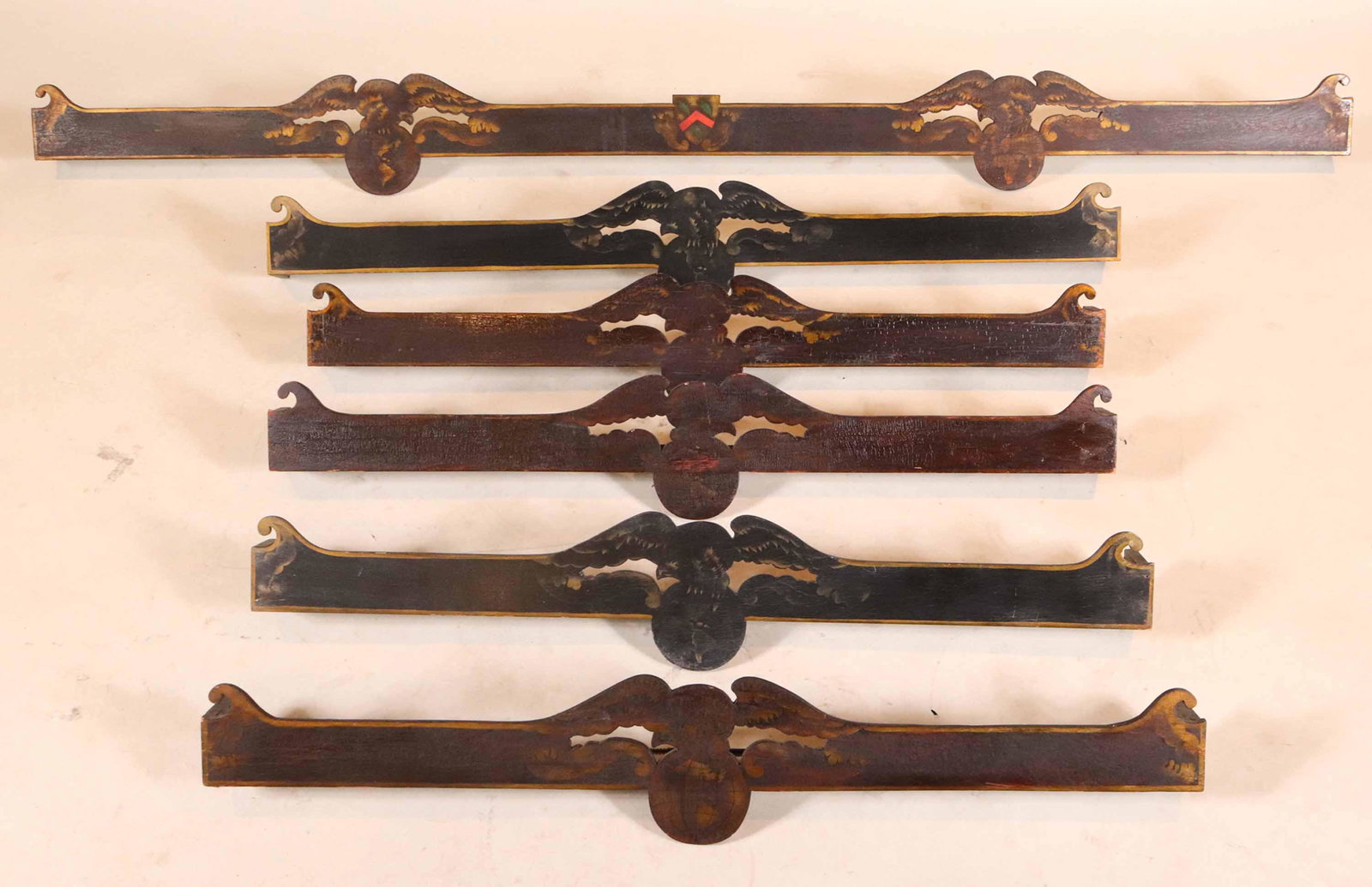 Six Neoclassical Paint and Stenciled Valences: Each painted with design of eagle atop globe Sizes from 36"l (3), 37"l (1), 42"l(1), 70-1/2"l(1)
