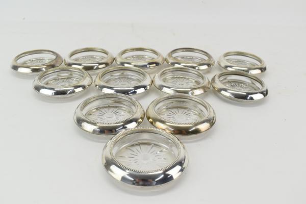 Twelve Frank Whiting Sterling and Glass Coasters: Twelve Frank Whiting Sterling and Glass Coasters, stamped with makers mark Used condition, wear, worn 3-7/8"dia