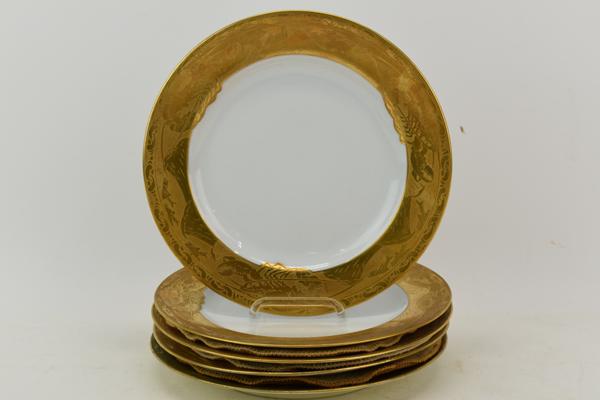 Four Tiffany and Co Gilt Ocean Scene Plates: Four Tiffany and Co Gilt Ocean Scene Plates together having gilt boarder depicting lobsters, fish, oceanic scene. Together with another of the same design having repairs and discoloration, appears to 