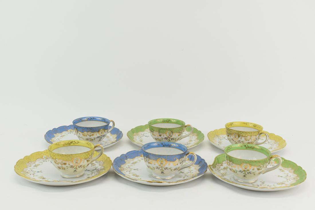 Set of Six Princeton China Tea and Cake Plate: Set of Six Princeton China Tea Cups and Cake Plates each having floral and gilt hand decoration including 2 blue motif tea cup and plate, 2 green motif cup and plate, and 2 yellow motif cup and plate,