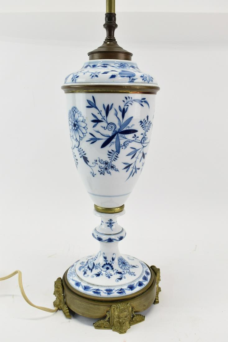 Vintage Blue Onion Porcelain Lamp: Vintage Blue Onion Porcelain Oil Lamp mounted as lamp having all over floral design, brass accents and base. Used condition, wear, worn, cracks, chips. overall size 28" tall x 7" at base