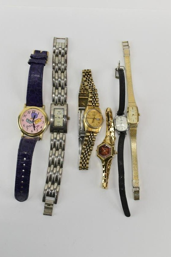 Four Assorted Vintage Seiko Ladies Watches: Four Assorted Vintage Seiko Ladies Watches each having different shape and style, each having gold color metal band. Together with a Barbie Watch with purple leather strap, a Lorus Quartz watch having