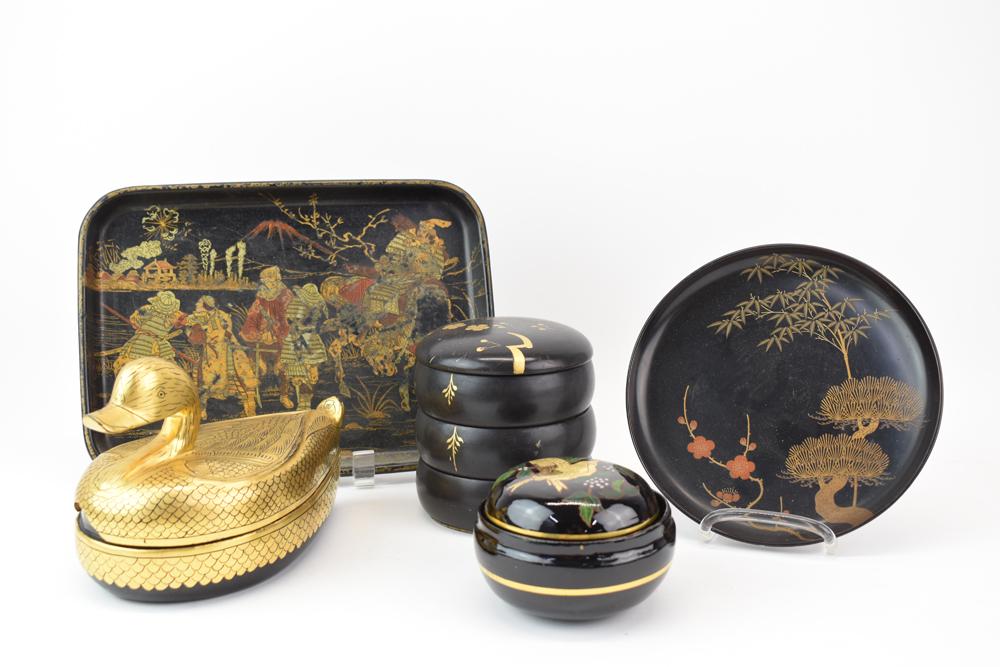 Group of Asian Black Lacquered Table Articles: Group of Assorted Asian Black Lacquered Table Articles including a gold duck box, a small platter, a dish, nesting boxes, a three tier wedding box Used condition, wear, worn, losses, large chip at fro
