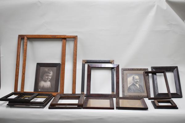 Sixteen Assorted Wood Picture Frames: Sixteen Assorted Wood Picture Frames, various sizes and styles. Wear, surface distress, losses Largest: 27"h x 31"w