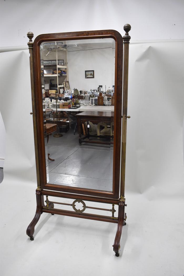 Antique Victorian Cheval Mirror: Antique Victorian Cheval Mirror mounted on brass column pillars with casters, wood frame having brass inlay surrounding a beveled glass mirror Used condition, wear/worn, repairs, missing rosettes, mir