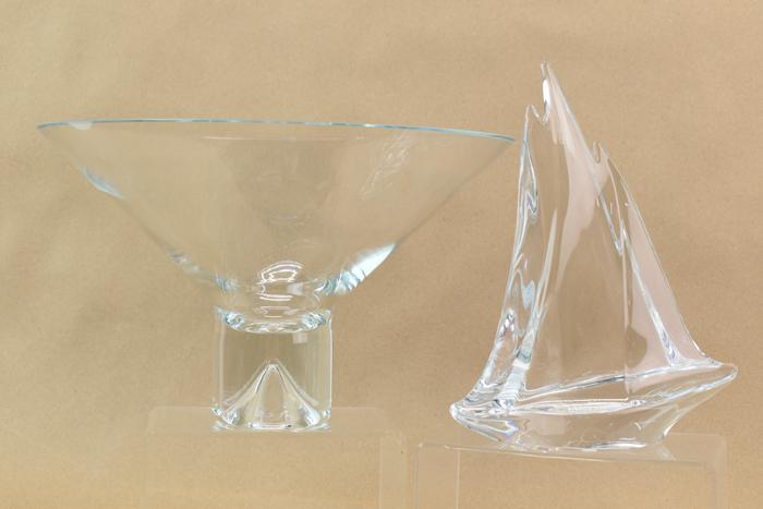 Large Modern Glass Bowl & Daum Sailboat: Large Modern Glass Bowl & Daum Sailboat, bowl having rim chip and measuring 7-1/8"h x 11-3/4"dia and the signed Daum France sailboat sculpture measuring 9"h x 6-7/8"w and in good condition.