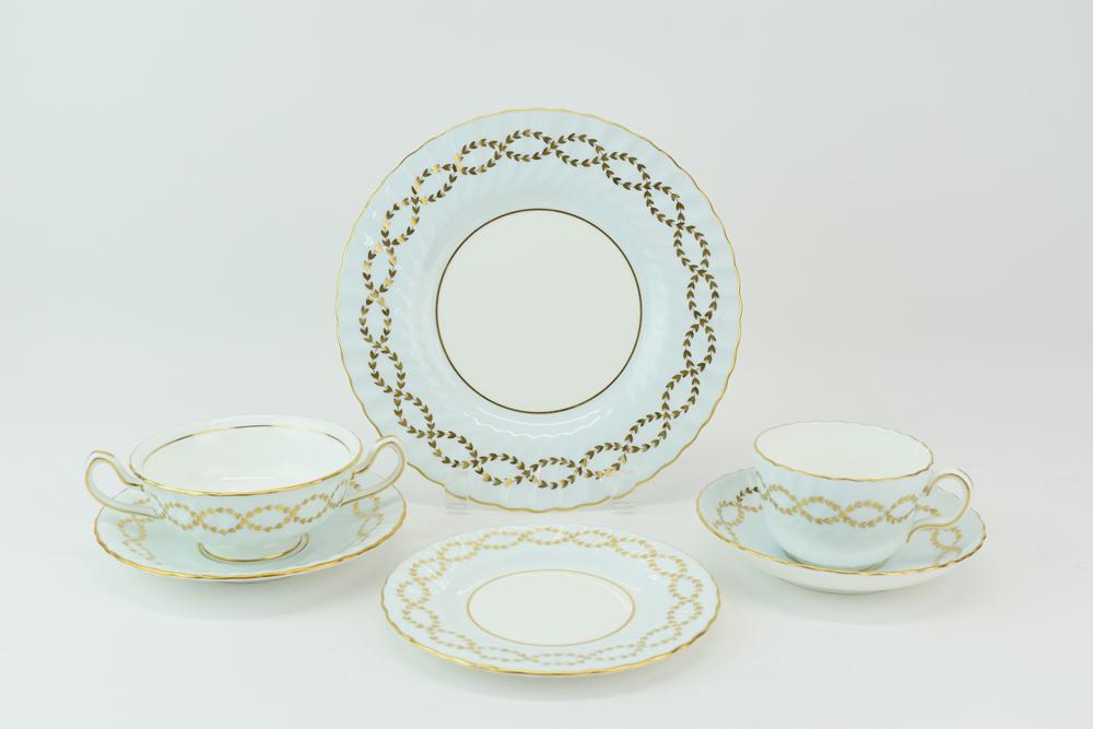 Minton Tiffany Partial China Set Blue Gilt Plates: Minton Tiffany Partial China Set Blue Gilt Plates, comprising 12 9"dia plates, 12 6-1/4"dia bread plates, 11 6-1/4"dia bouillon saucers, 12 handled bouillon cup bowls, 12 5-5/8"dia saucer plates, and 