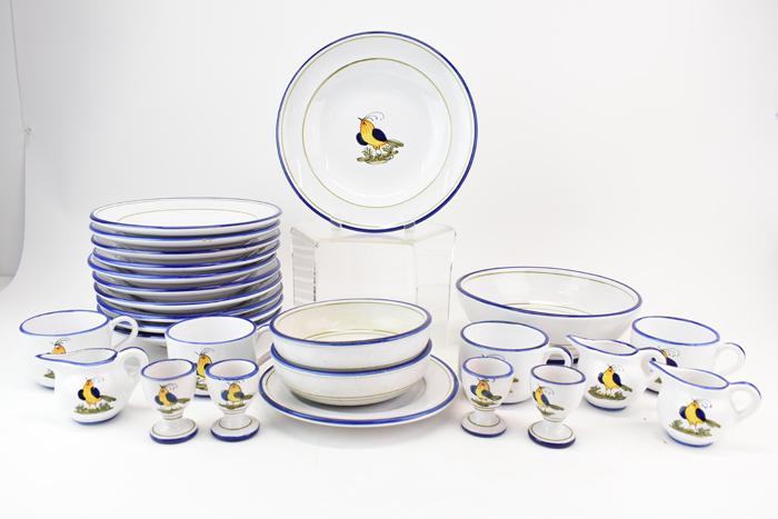 Partial Set of Deruta Hand Painted Dinnerware: Partial Set of Italian Deruta Hand Painted Dinnerware having blue winged yellow bird central design and cobalt rim. Comprising of 11 wide rim soup bowls, 2 cereal bowls, 4 egg cup, 4 cups, 3 creamers,