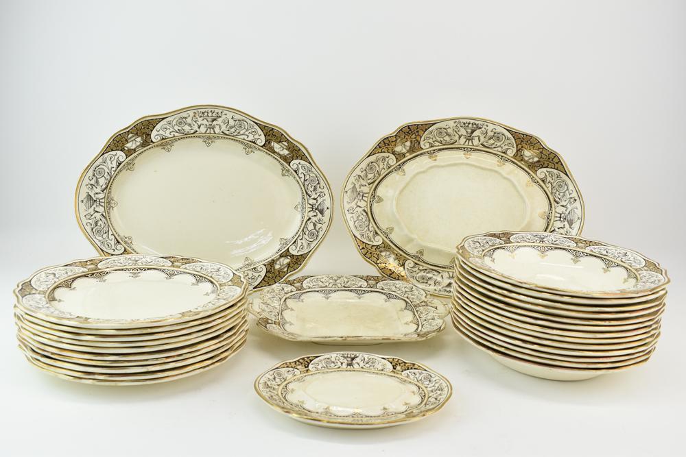Queen Charlotte Wedgwood Partial Dinnerware Set: Vintage Queen Charlotte Wedgwood Partial Dinnerware Set having sepia and gilt design around border, comprising ten 10" plates, thirteen 9-1/4" bowls, and 4 serving platters Used condition, wear, worn,
