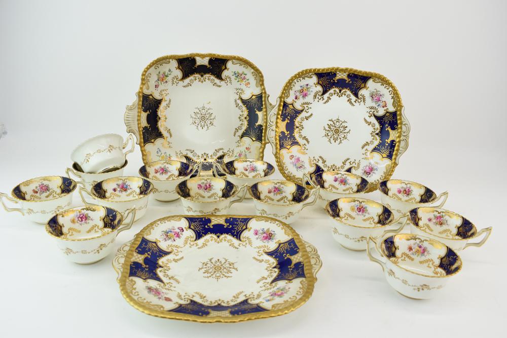 Partial Coalport Panel Cobalt Dinnerware: Partial Coalport "Panel Cobalt" Dinnerware comprising of 14 cups, 2 handled plates and one handled serving dish Used condition, wear, worn, surface distress The largest: 11-1/2"l x 9-1/2"w