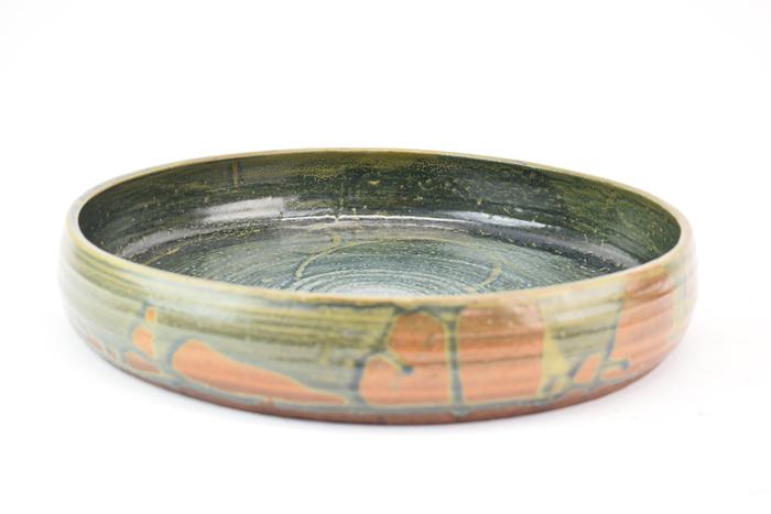 Large Flat Bottom Art Pottery Bowl: Large Flat Bottom Art Pottery Bowl in blue and rust glazes, signed illegibly on underside Used condition Appx. 14-1/4"dia x 2-1/2"h