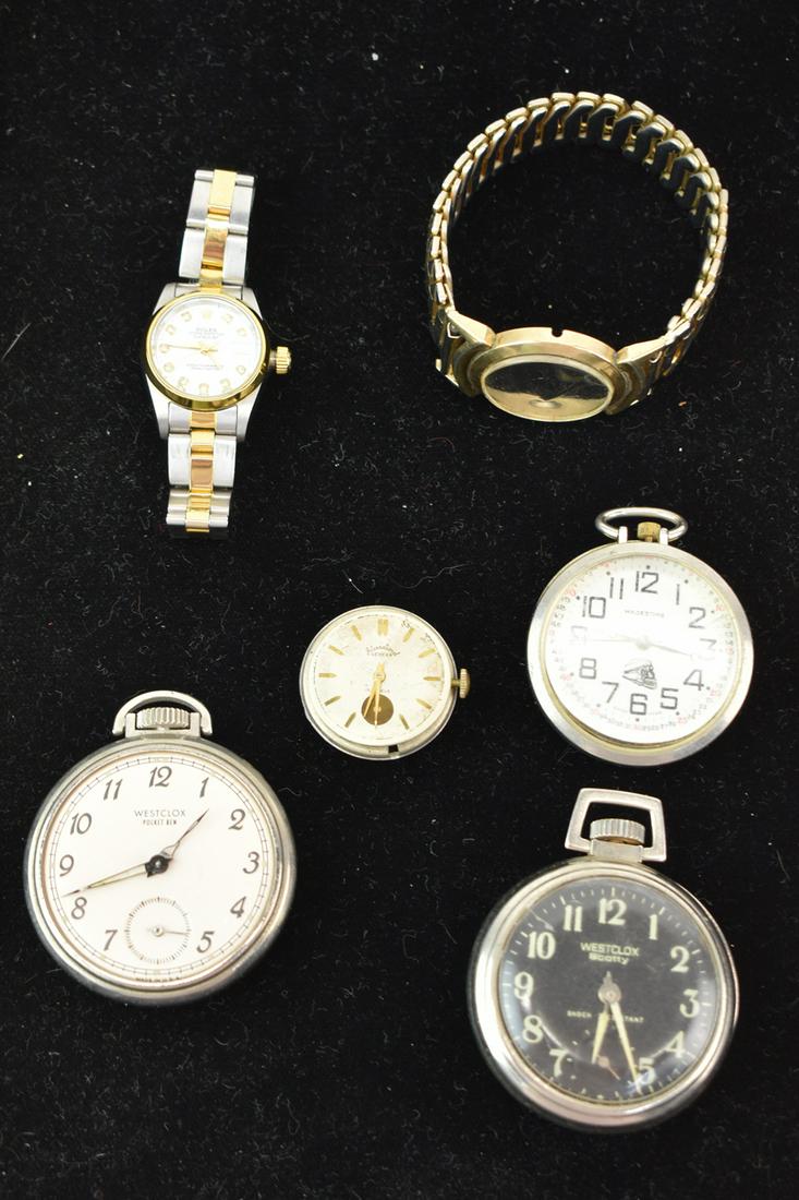 Group of Assorted Watches: Group of Assorted Watches. Including a Faux Rolex and International Geneva wristwatches. Along with 2 Westclox and Majestime pocket watchs. Used not in working condition, wear, worn, maybe missing pie