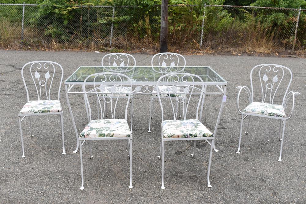Set Salterini Style Glass Top Table and Chairs: Set Salterini Style Glass Top Table and Chairs with leaf motif. Five side chairs, one arm chair. Used condition with surface wear and losses, chips to glass top corners. Table appx: 29-1/2"h x 60"l x