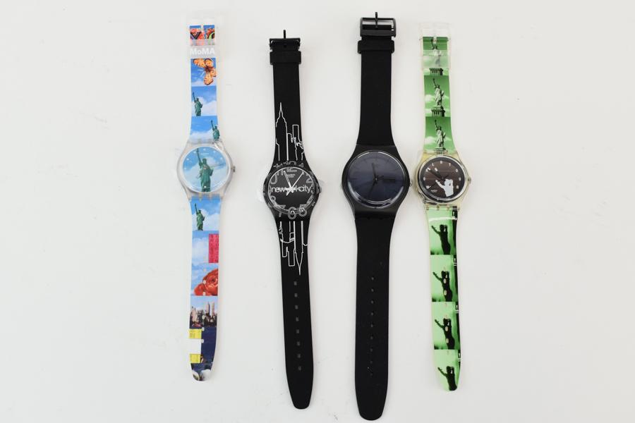 Group of NYC Themed Swatch Watches: Group of New York City Themed Swatch Watches (including one SOLAR POWERED) together with an all black Swatch Watch with day and date features (SUOB702 - unworn), Lines in the Sky (New York City GK309