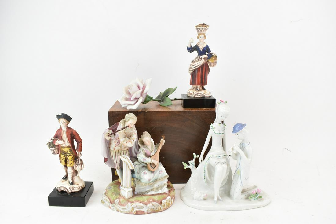 Rosenthal Raymond Peynet Musician Couple Figure: Rosenthal Raymond Peynet Musician Couple Figure, together with another German figure group with musicians, a capidomonte rose, and two village figures on black pedestal bases. Five pieces altogether.