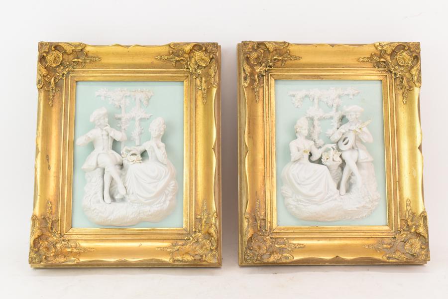 Alt Meissen Art Sancoucci Rococo Figural Plaques: Alt Meissen Art Sancoucci Rococo Figural Plaques, gilt framed bisque three dimensional depictions of musican men playing for their ladies. One appears to be missing his flute, the other has a glue rep