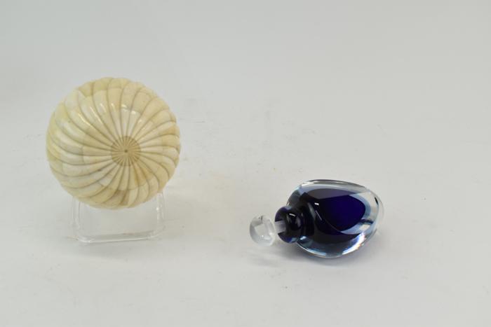 Two Assorted Vintage Articles: Two Assorted Vintage Articles including a signed James Clark cobalt perfume bottle signed at bottom, and a decorative bone carved carpet ball Used condition, wear, worn, perfume bottle has scratch at 