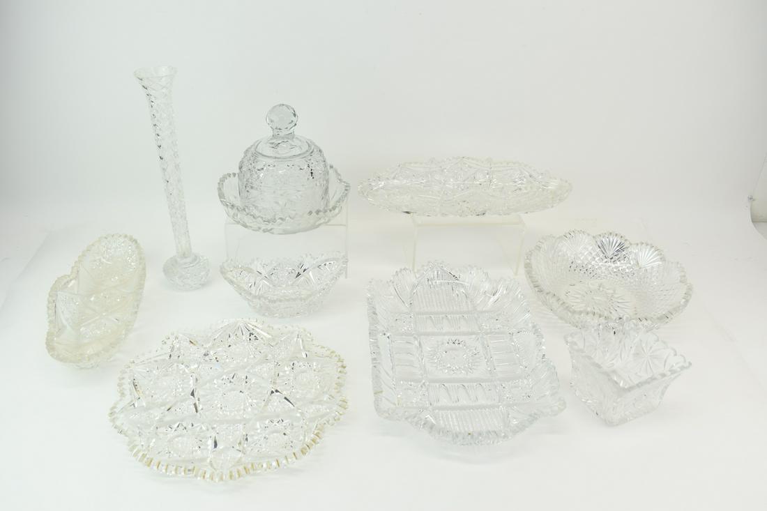 Nine Cut Glass Table Articles: Nine Cut Glass Table Articles, including, plates, dishes, bud vase, covered dish, bowls. Tallest: 12"h Used condition, wear/worn, chips.