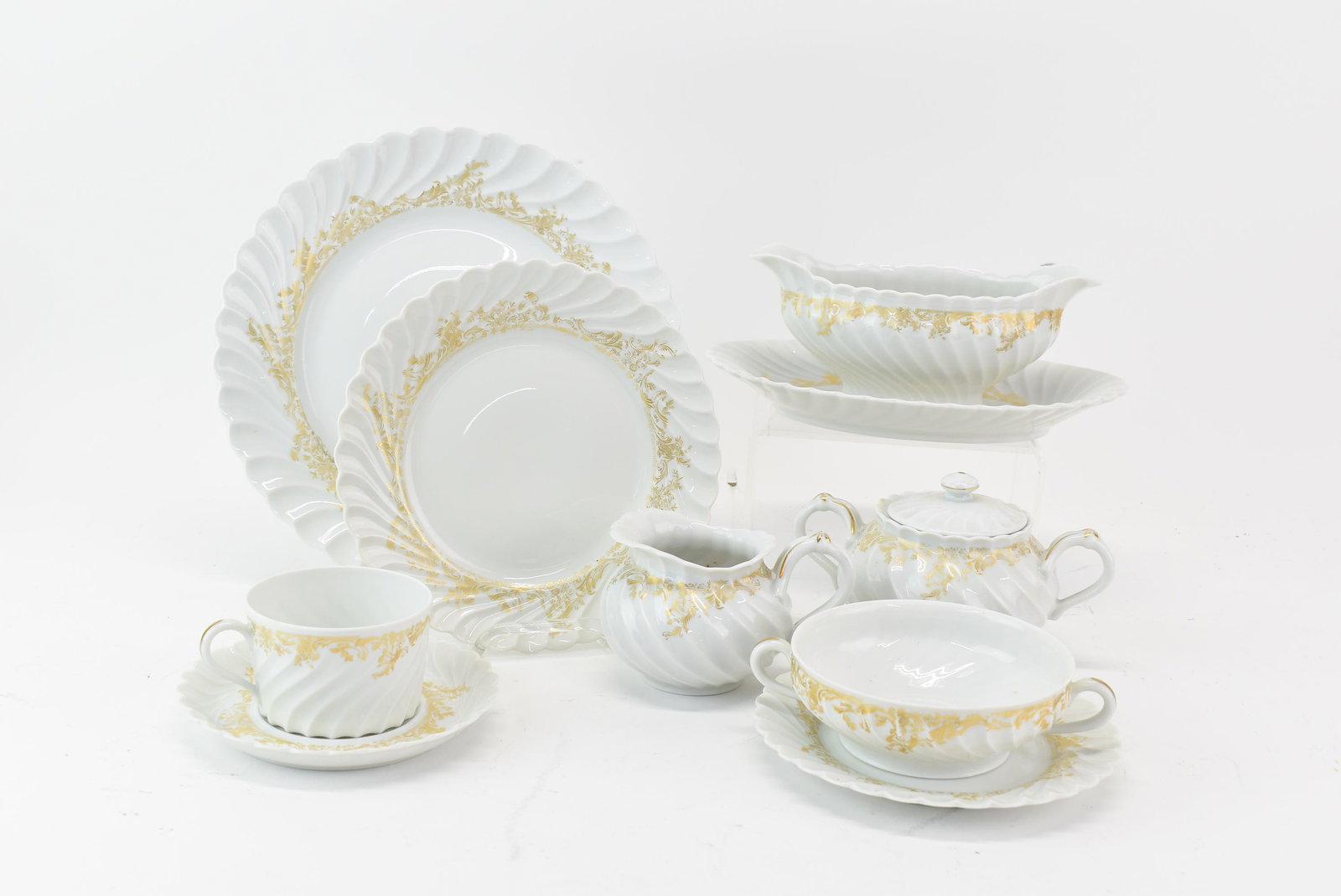 Limoges Gold & White Ladore Dinner China Set: Limoges Gold & White Ladore Dinner China Set (84) pieces total, marked "Haviland Limoges Ladore" and decorated with gold on white wavy rimmed ground. (13) 10-1/4" dinner plates, (12) 7-3/4" dessert or