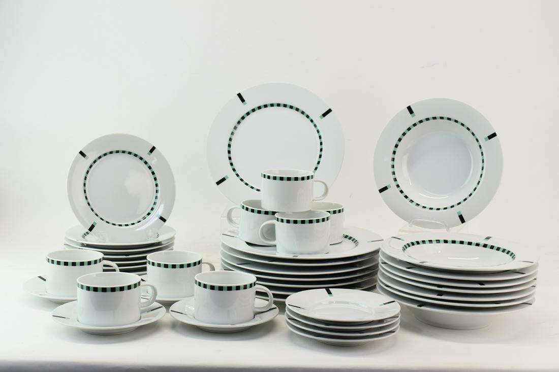 Set of Sasaki Register Green Dinnerware: Set of Sasaki by Soichiro Sasakura Register Green Dinnerware having a white ground with green and black modern pattern, includes 8 dinner plates (10 3/4" diameter), 7 salad plates (7 3/4" diameter), 8