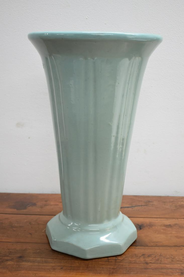 Light Blue-Green Art Pottery Umbrella Stand: Light Blue-Green Art Pottery Umbrella Stand with ribbed body and sided base, "I.C.H.S." written in marker on base. Used condition with general surface wear, some pitting in glaze, some cracks on sides