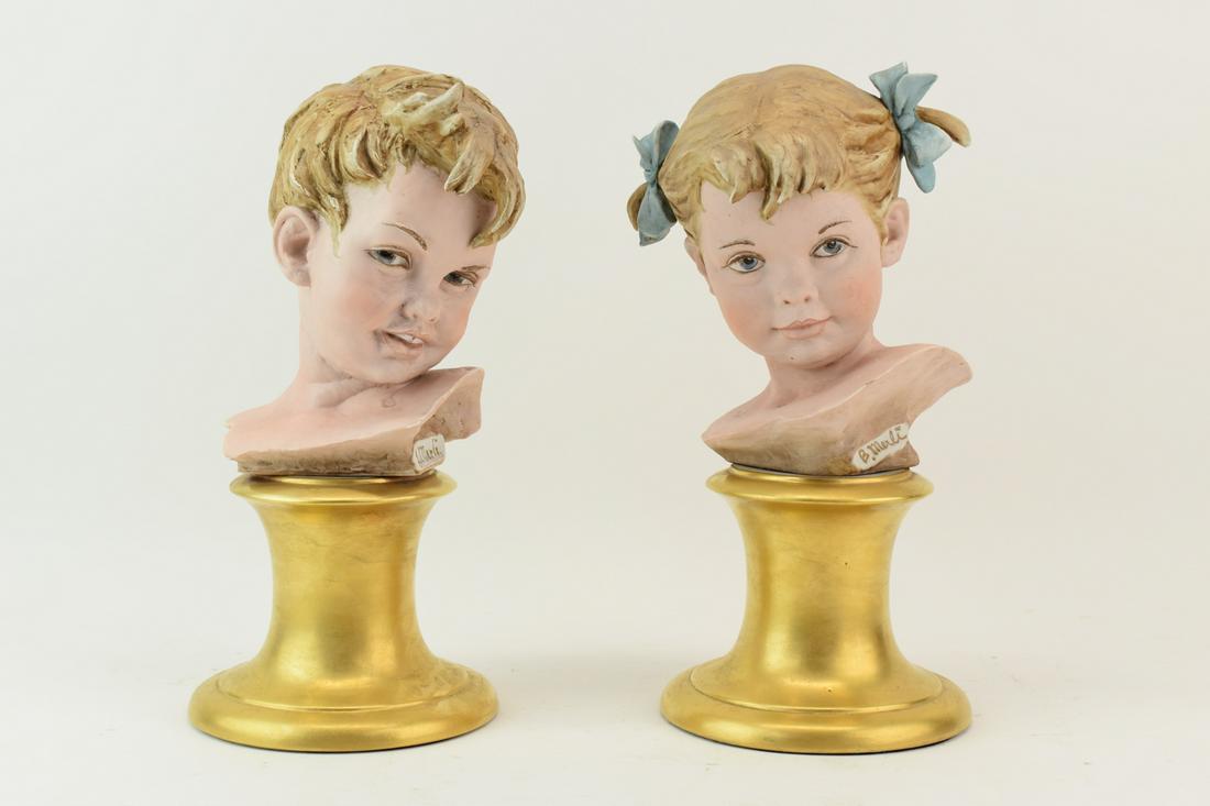 Pair B Merli Children Busts Italian Bisque: Pair B Merli Children Busts Italian Bisque porcelain on gold gilt pedestal bases. Used condition, surface wear but otherwise appear to be free from chips or cracks. Appx: 13"h x 6"dia bases.