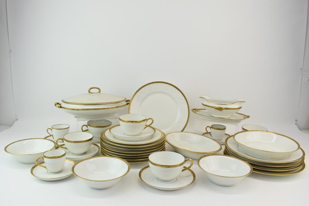 Vintage Partial Limoges French Dinnerware Set: Vintage Partial Limoges French Dinnerware Set having gilt foliate design rim, comprising 1 vegetable dish 9"dia, 5 dinner plates 9-3/8"dia, 1 handled covered casserole dish 11-3/4"dia, 4 demitasse cup