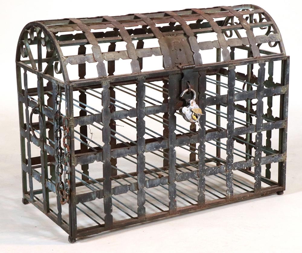 Wrought and Cast-Iron Wine Bottle Storage Trunk: With lock and fall front door. Some wear and rust. 23"h x 29"w x 14-1/2"d Provenance: Roberto Freitas, Stonington, CT