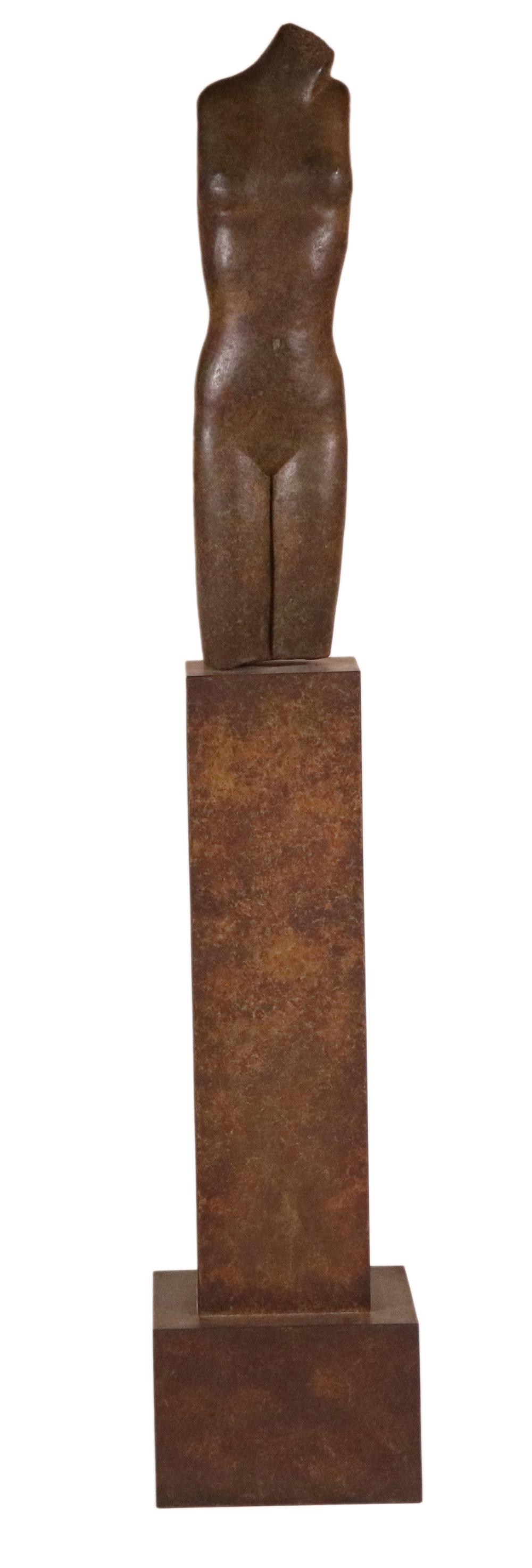 Anita Huffington, Bronze, "Kore": (American, b. 1934) 1991, edition 7 of 7 Sculpture: 55"h x 7-1/2"w x 6"d Overall: 64"h x 11-1/2"w x 10"d Provenance: Property from the Estates of David and Laura Finn, Westchester County, NY