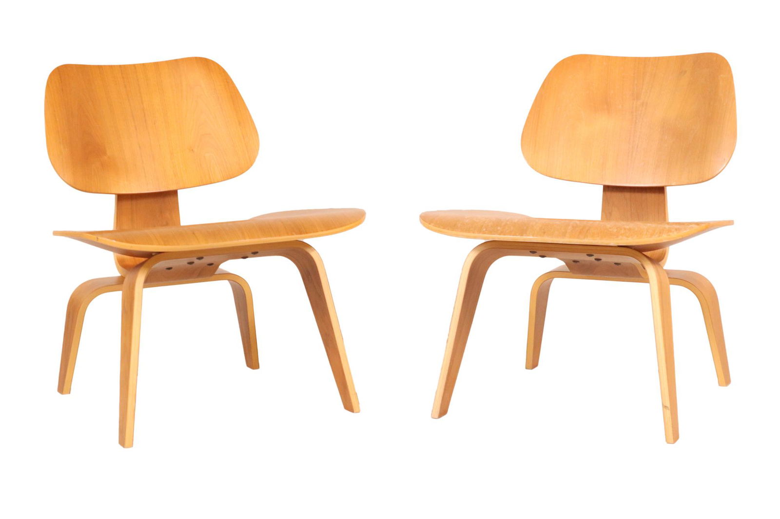 Two Eames for Herman Miller Low Chairs: 20th C., each with label on underside Each 26-1/2"h x 21-3/4"w x 18"d, seat height appx. 15"h Provenance: Property from the Estates of David and Laura Finn, Westchester County, NY
