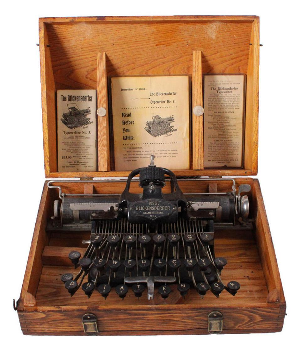 Blickensderfer Portable Typewriter No. 5: ca. 1896, in its original oak carrying case, together with a hotel visitor's guide with Blickensderfer advertisement, a "Read before You Write" guide, and an ink roll instruction guide Case: 7-1/2"h x
