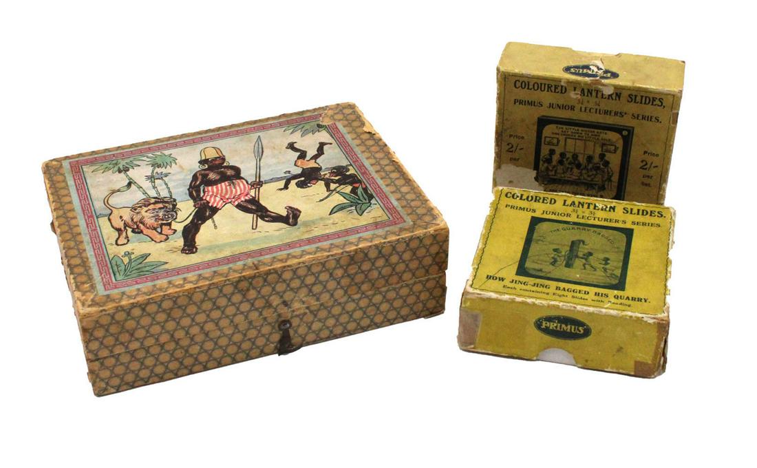 Two Black Americana Magic Lantern Slide Sets: Manufactured by Primus, slides made by Wilhelm Busch, ca. 1900, comprising no. 504 and no. 515; together with a lithographed paper block puzzle game in original box, 3 pieces total