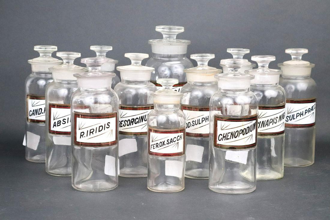 Twelve Glass Apothecary Jars: ca. 1900, with glass labels Heights from 6-7/8"h to 9-1/2"h