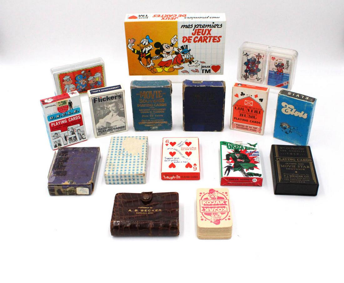 Sixteen Vintage Hollywood Themed Decks of Cards: Including Green Hornet, Mickey Mouse, Country Music Stars, The Man from U.N.C.L.E., Elvis, Smurfs, and Kojak.