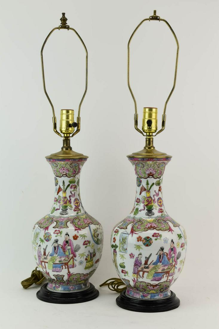 Pair of Famille Rose Style Urns Mounted as Lamps: Pair of Famille Rose Style Urns Mounted as Lamps. Used condition, missing one finial. 25"h x 6-1/2"dia