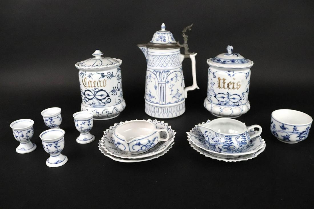 Fourteen Blue and White Porcelain Table Articles: Some German, comprising two covered jars, a stein, two creamers, a cup, four egg cups, and four plates.