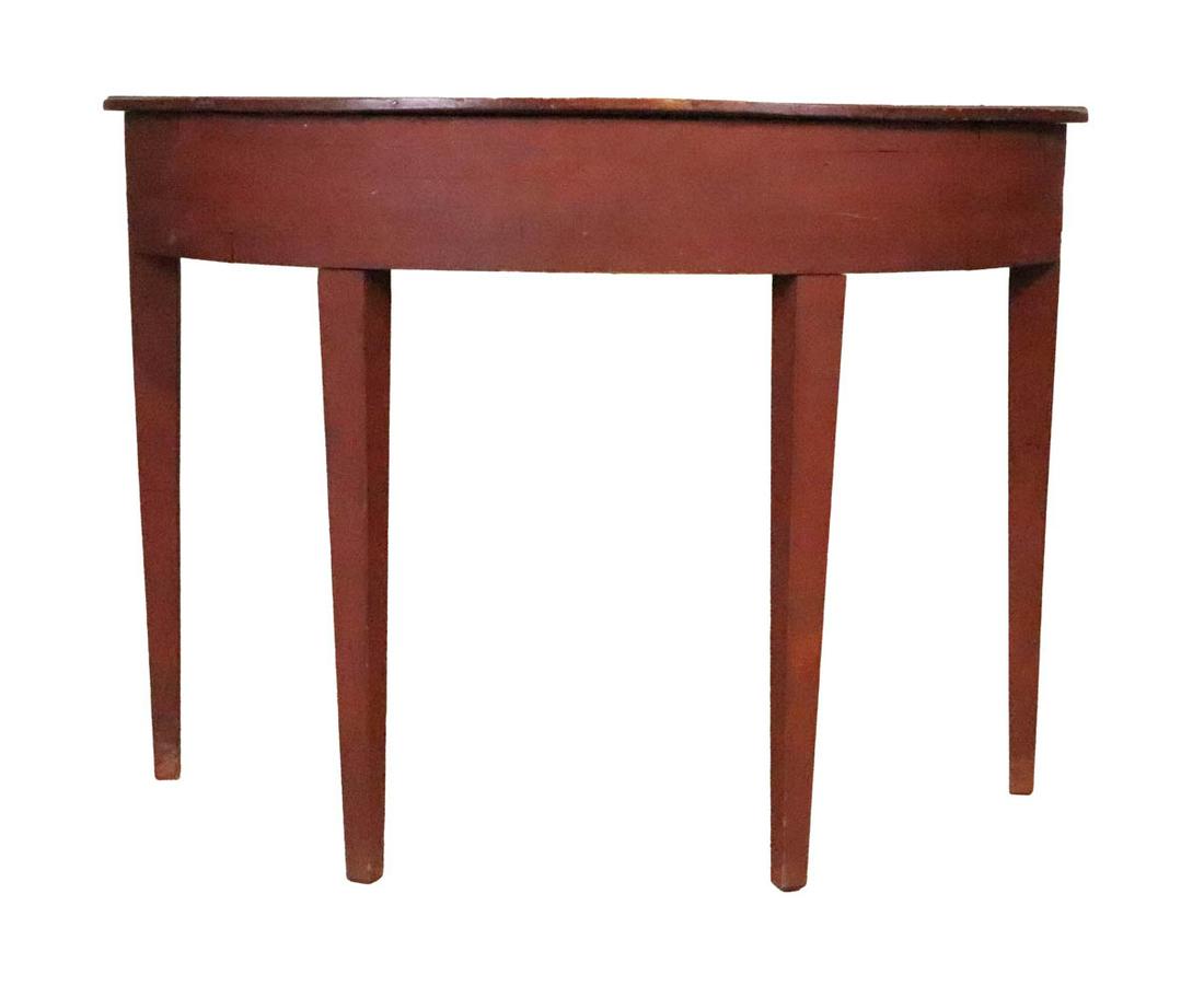 Red Stained Demi-Lune Pier Table: 20th C. Stains, wear, surface distress, top warped. 32"h x 44-1/2"w x 21-1/2"d Provenance: Property from the Estate of Edward G. Bohn
