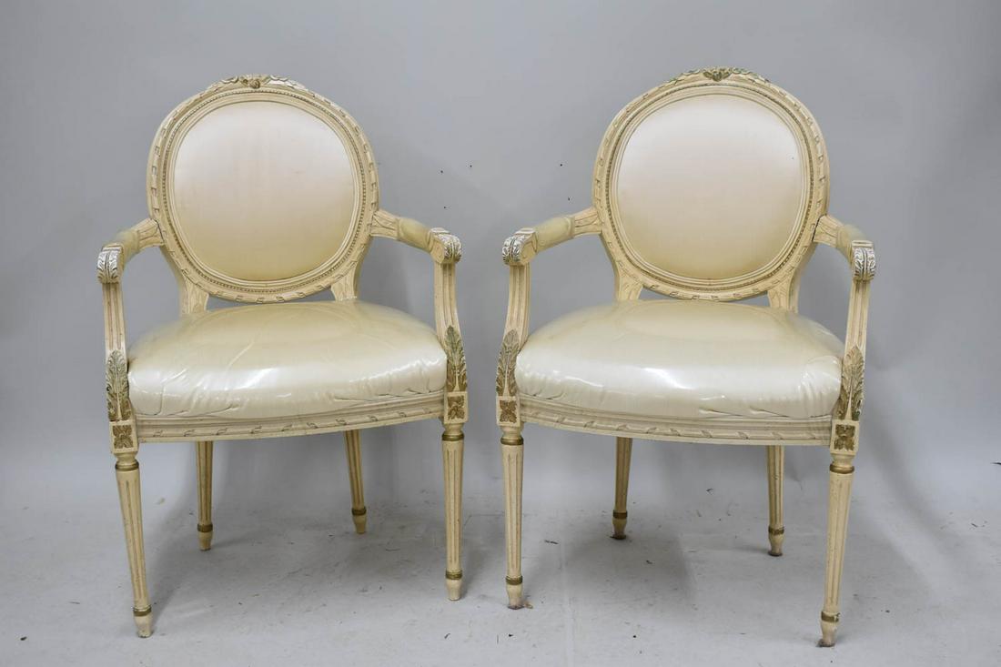 Pair of Louis XVI Style Fauteuils: Pair of Louis XVI Style Fauteuils each having carved floral crest above white upholstered backrest, arms, and seat Used condition, minor stains on upholstery 39"h x 25"w x 23"d x 21"h to top of seat.