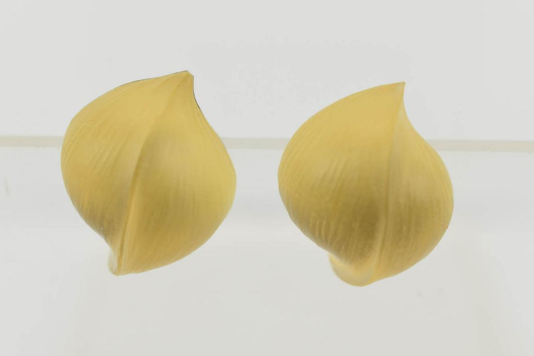 Alexis Bittar Pair Hand Carved Lucite Ear Clips: Alexis Bittar Pair Hand Carved Lucite Ear Clips, oval gold tone plaque signed Alexis Bitter, gold color lucite Each appx. 1"l.