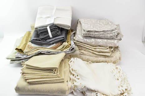 Large Group of Table Linens: Large Group of Table Linens, including a runner, William Sonoma tablecloths, napkins, Crate + Barrel placemats, Jim Thompson placemats and napkins, and assorted tablecloths. Used condition, wear, stai