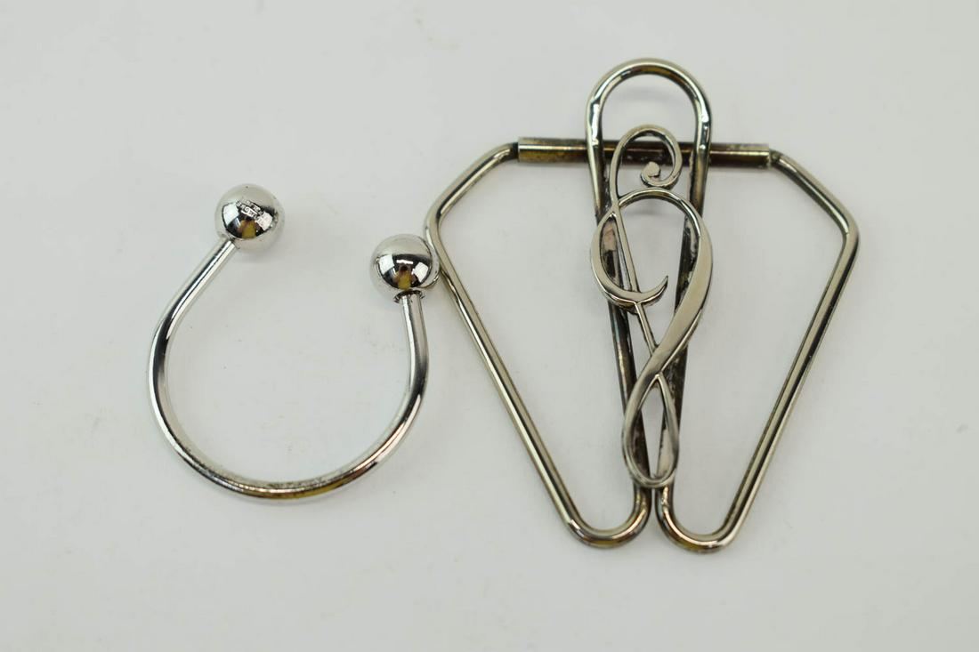 Silver Musical "G" Clef Money Clip: Silver Musical "G" Clef Money Clip, 2-1/2"l; together with a silver key ring, ball end unscrews for keys Used condition.
