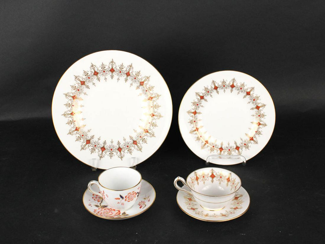 Royal Crown Derby "Cherbourg" Dinner Service: Comprising 11 dinner plates, 11 luncheon plates, 11 bread and butter plates, and 11 cups and saucers, together with 6 Staffordshire cups and saucers, 67 pieces total Wear, surface distress.