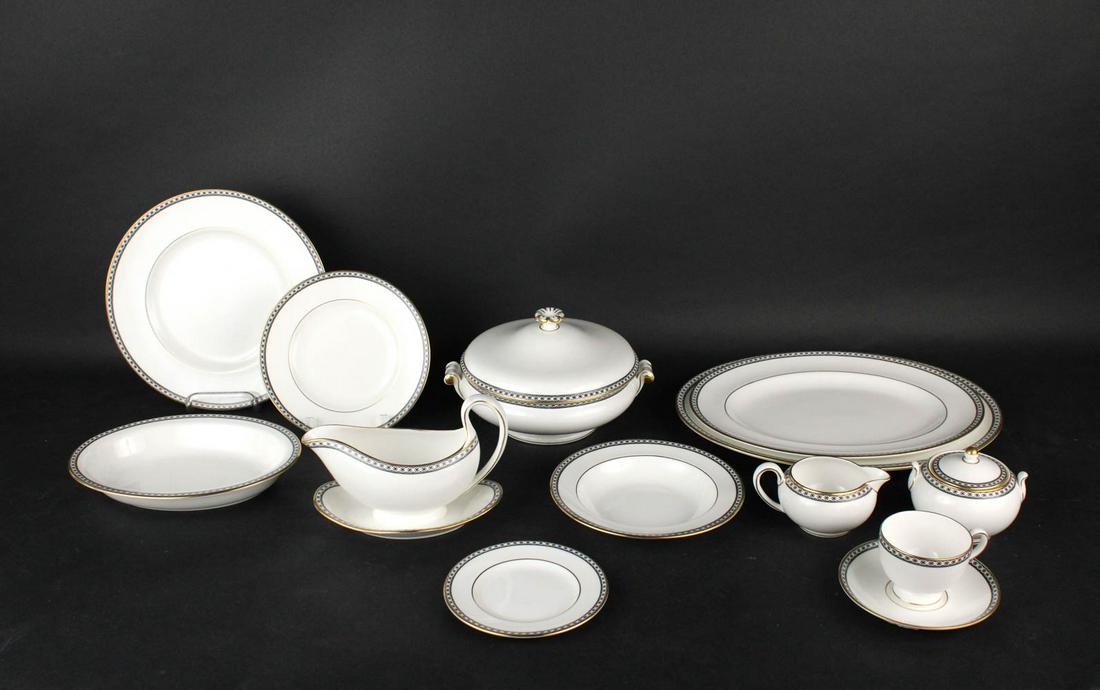 Wedgwood "Black Ulander" Porcelain Dinner Service: Comprising 12 dinner plates, 12 luncheon plates, 12 soup bowls, 13 bread and butter plates, 14 cups and saucers, a covered vegetable dish, two oval platters, an oval bowl, a gravy boat, a creamer and