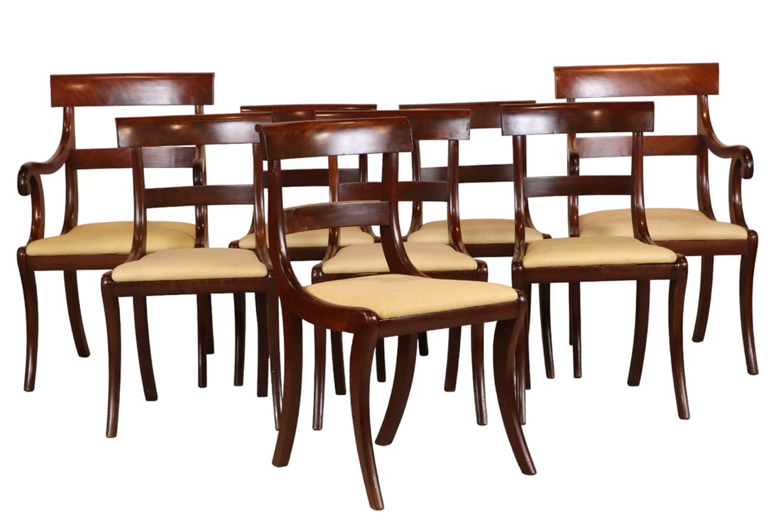 Set of Eight Classical Mahogany Dining Chairs: Attributed to Duncan Phyfe, New York, circa 1835. 8 pieces. Various repairs. Armchair: 36"h Side chair: 32"h Note: The 1835 inventory and account book of Isaac Ogden at Island House in the St. Lawrenc