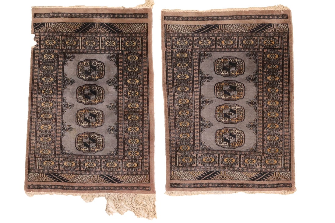 Pair of Pakistan Bokhara Mats: Pakistan, contemporary Area missing from side on one, minor moth damage on the other Each appx. 35-3/4"h x 23-1/4"w