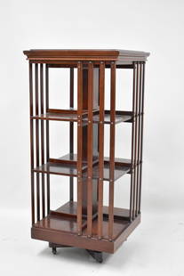 Antique Mahogany Revolving Bookcase: Antique Mahogany Revolving Bookcase having three tiers, resting on metal and wooden base. Used condition, wear, worn. 44" tall x 20" x 20"