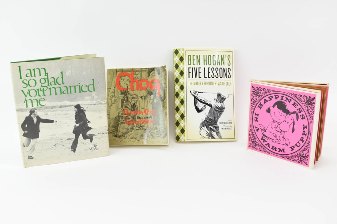 Charles Schulz "Happiness is a Warm Puppy" 1962: Charles Schulz "Happiness is a Warm Puppy" 1962, hard cover with dust jacket, 5-3/4"h x 5-3/4"w. Together with Lois Wise "I Am So Glad You Married Me", hard cover with dust jacket 1971, Quentin Crisp 