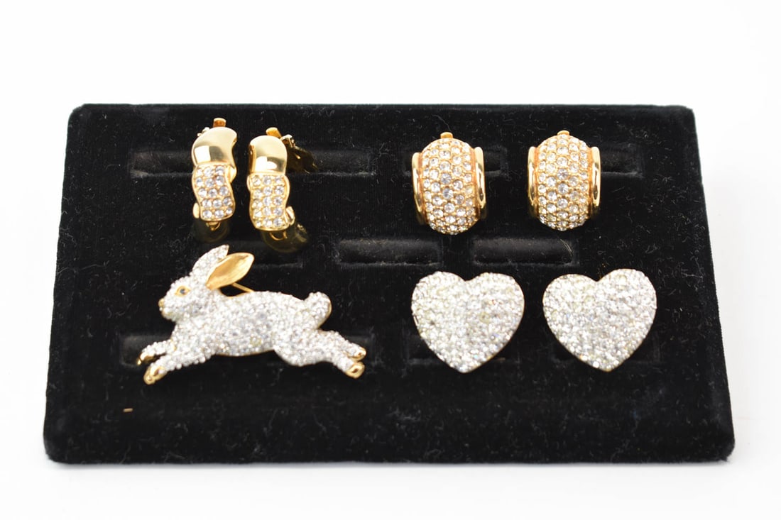 Group of Assorted Swarovski Jewelry Articles: Group of Assorted Swarovski Jewelry Articles Including a bunny brooch, pair of heart form ear clips and 2 pair of hoop ear clips. Used condition
