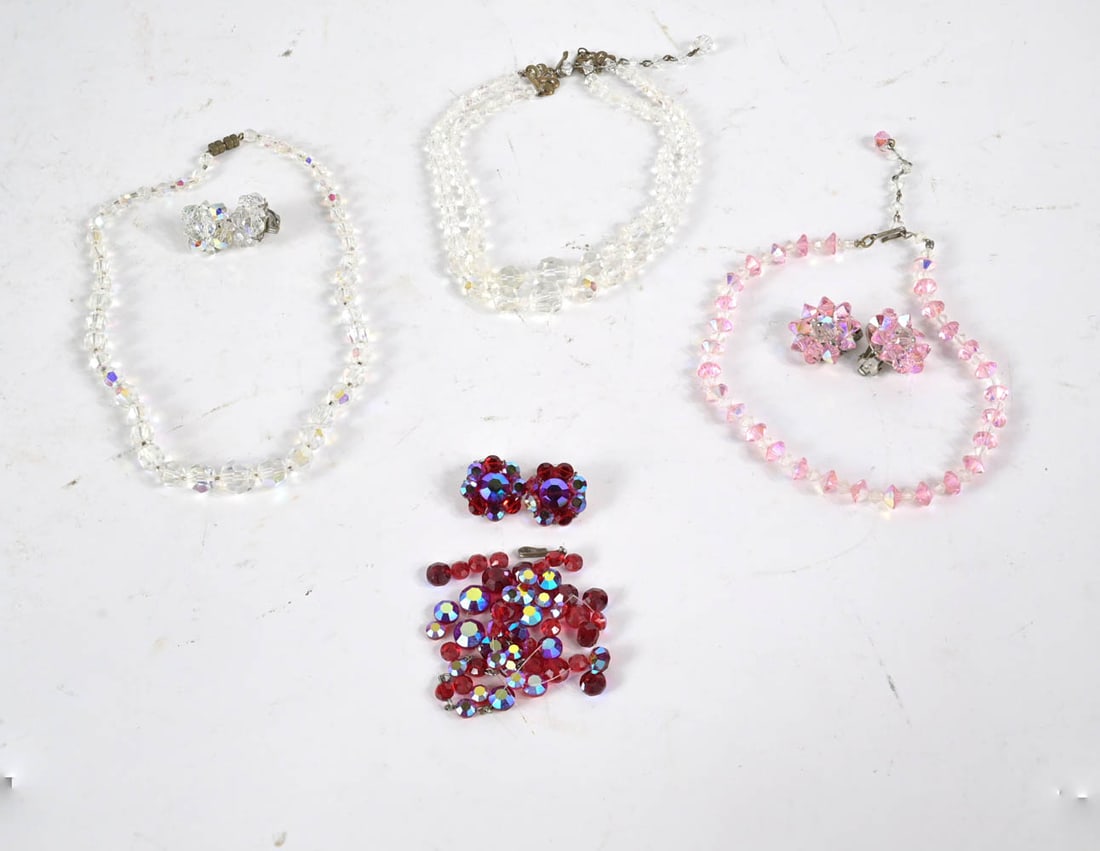 Vintage Aurora Borealis Crystal Beaded Jewelry: Vintage Aurora Borealis Crystal Beaded Jewelry, comprising a red necklace, needs restringing, with matching earrings; a double colorless choker necklace (13"l); a colorless necklace (16"l) with matchi