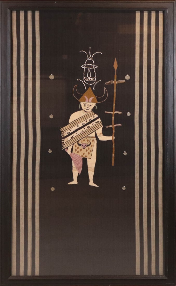 Southeast Asian Embroidery of a Warrior: Southeast Asian Embroidery of a Warrior, 20th/21st C., decorated with seed pods and Burmese silver coins Overall: 72-3/4"h x 42"w Sight: 67-3/8"h x 37-1/4"w